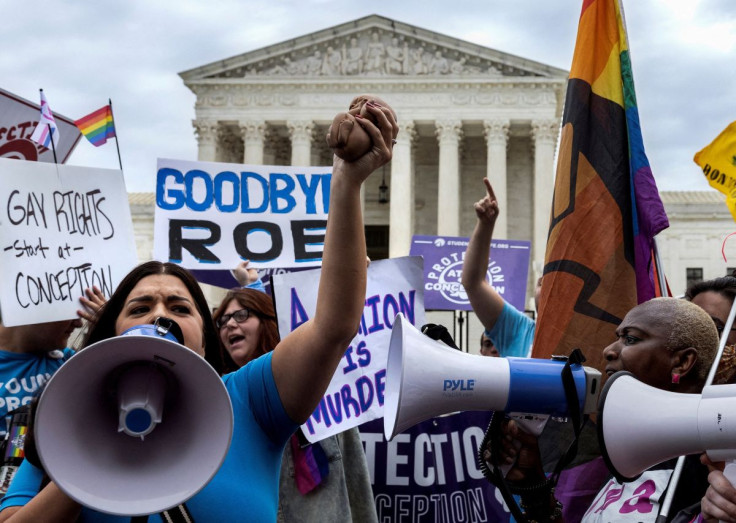 Abortion rights supporters and anti-abortion demonstrators protest outside the United States Supreme Court in Washington, U.S., June 21, 2022. 