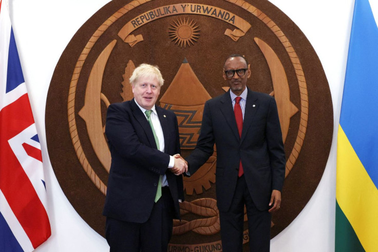 British Prime Minister Boris Johnson shakes hands with Rwandan President Paul Kagame during a bilateral meeting on the sidelines of the Commonwealth Heads of Government Meeting (CHOGM) at the office of the President in Kigali, Rwanda June 23, 2022. Dan Ki