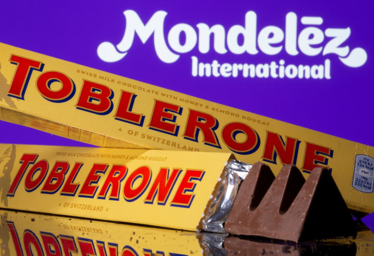Toblerone Swiss milk chocolates are seen displayed in front of Mondelez International logo in this illustration picture taken July 26, 2021.