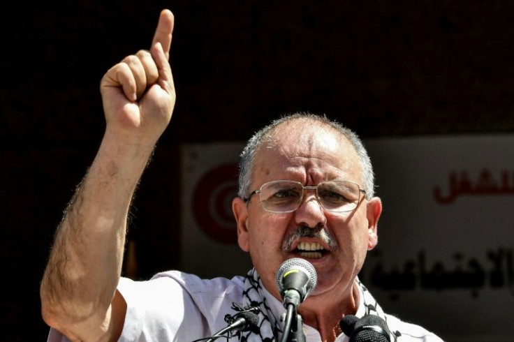 The head of Tunisia's UGTT trade union confederation addresses supporters on June 16, the first day of a public sector strike opposing the government's proposals for IMF-backed reforms