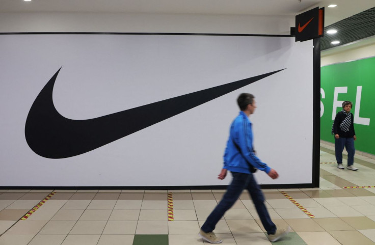 People walk past a closed store of the sporting goods retailer Nike at a shopping mall in Saint Petersburg, Russia May 25, 2022. 