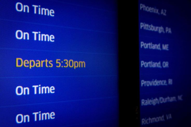 A screen displays flight status at O'Hare International Airport ahead of the Thanksgiving holiday in Chicago, Illinois, U.S., November 20, 2021.  