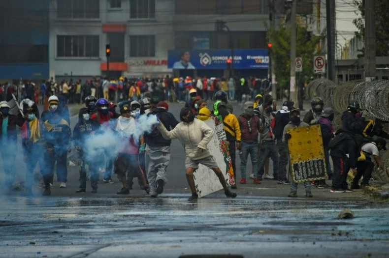 Indigenous demonstrators clash with police in the surroundings of the Comptroller General's Office headquarters, in Arbolito Park, Quito on June 23, 2022