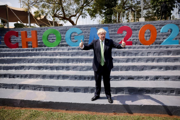 British Prime Minister Boris Johnson poses as he attends the Commonwealth Business Forum Exhibition at the Kigali Cultural Village in Kigali, Rwanda June 23, 2022. Dan Kitwood/Pool via REUTERS