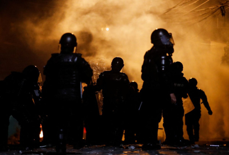 Riot police officers hold their shields during an anti-government protest amid a stalemate between the government of President Guillermo Lasso and largely indigenous demonstrators who demand an end to emergency measures, in Quito, Ecuador June 23, 2022. 