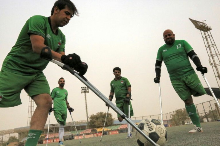 Members of the Iraqi national football team for amputees take part in a training session at Al-Shaab stadium in Baghdad