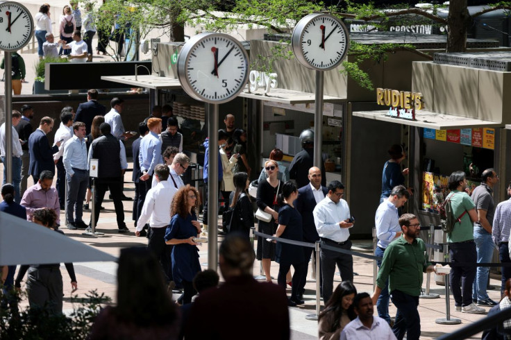 People queue for food in the financial district of Canary Wharf in London, Britain, May 18, 2022.