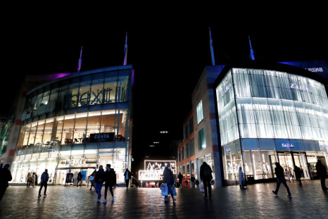 Shoppers are seen walking near Bullring shopping centre, owned by mall operator Hammerson, in Birmingham, Britain, November 4, 2020. 