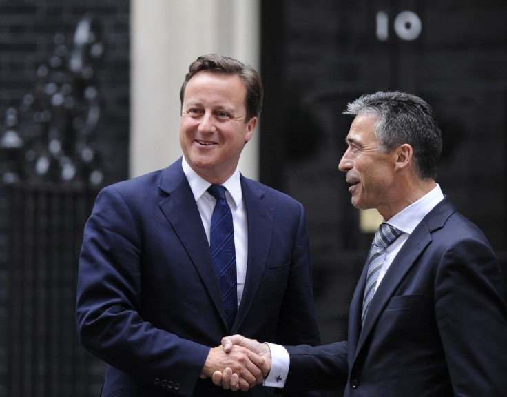 Britain&#039;s Prime Minister David Cameron greets NATO Secretary-General Anders Fogh Rasmussen outside 10 Downing Street