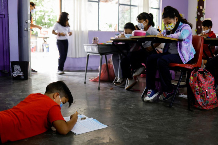 Students wearing protective masks attend a class in person as the coronavirus disease (COVID-19) outbreak continues, in Ciudad Juarez, Mexico June 22, 2022.  