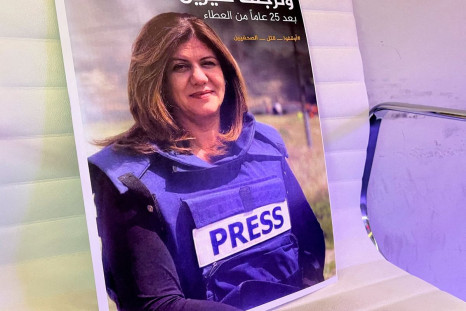A picture of Al Jazeera reporter Shireen Abu Akleh, who was killed during an Israeli raid in Jenin, is displayed at the Al-Jazeera headquarters building in Doha, Qatar, May 11, 2022. 