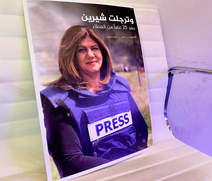 A picture of Al Jazeera reporter Shireen Abu Akleh, who was killed during an Israeli raid in Jenin, is displayed at the Al-Jazeera headquarters building in Doha, Qatar, May 11, 2022. 