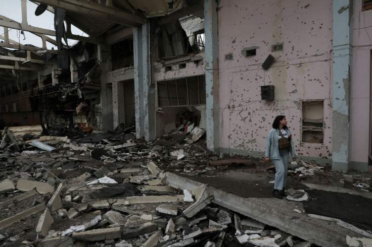 A person surveys the damage after a sports complex of an educational institution was shelled overnight as Russia's attack on Ukraine continues in Kharkiv, Ukraine, June 24, 2022. 