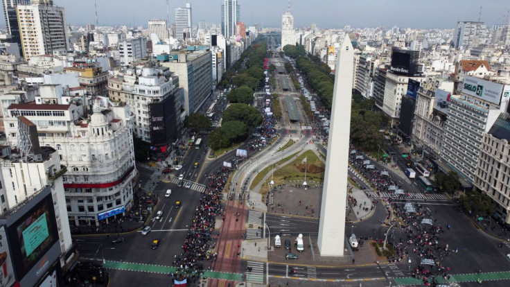 Demonstrators march past the Obelisk towards the Ministry of Social Development demanding fair employment and government support as inflation reaches historical numbers, in Buenos Aires, Argentina June 16, 2022. Picture taken with a drone. 