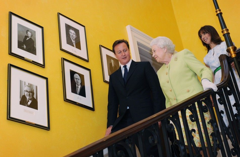Britain039s Queen Elizabeth walks down the staircase at number 10 Downing Street with Prime Minister David Cameron and his wife Samantha