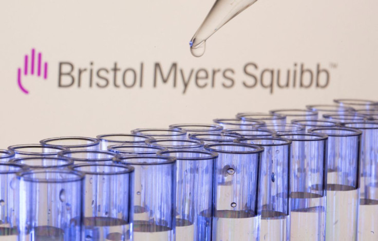 Test tubes are seen in front of a displayed Bristol Myers Squibb logo in this illustration taken, May 21, 2021. 