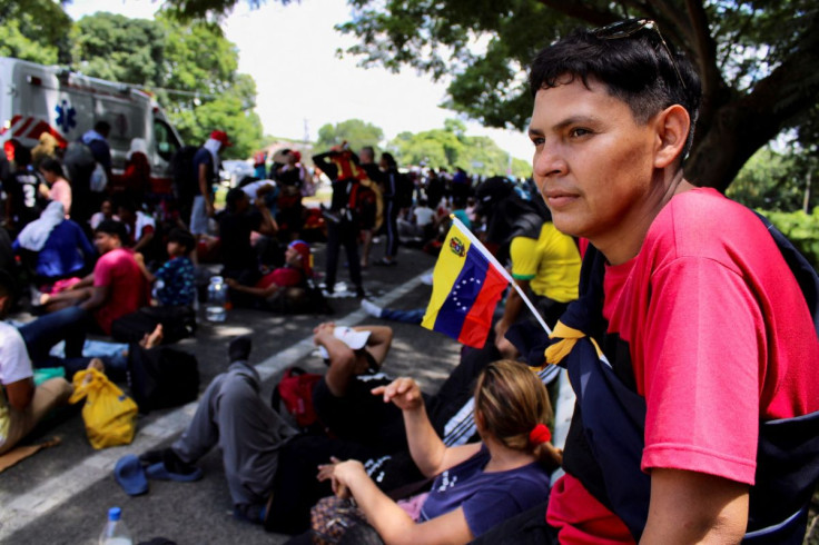 Venezuelans rest as they take part in a caravan after growing impatient of waiting for the humanitarian visa to cross the country to reach the United States, in Tapachula, in Chiapas state, Mexico June 24, 2022.