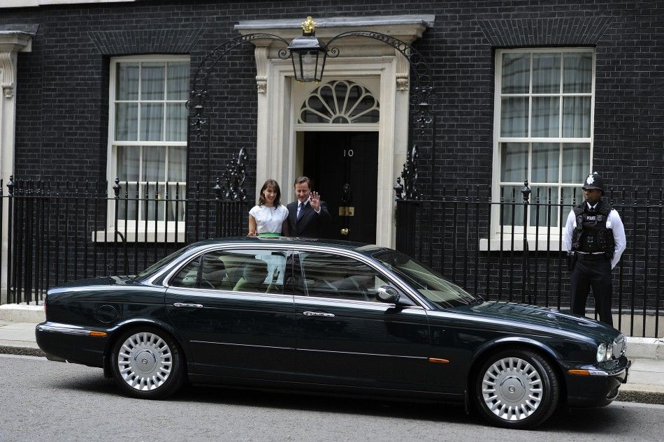 Britain039s Prime Minister David Cameron and his wife Samantha wave as Queen Elizabeth and Prince Philip leave after a lunch at number 10 Downing Street in London