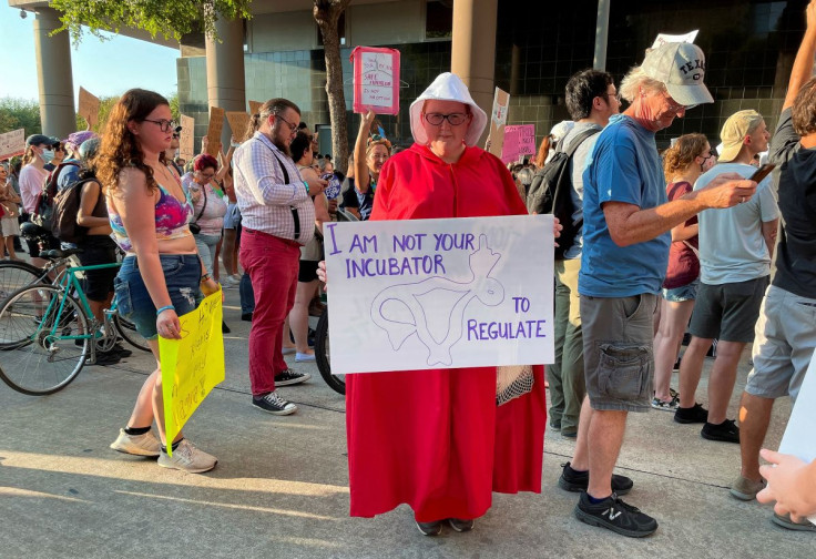 Sara Ellis, 37, wearing a Handmaid's Tale costume, attends a protest in response to the U.S. Supreme Court ruling overturning Roe v. Wade abortion rights decision, in Houston, Texas, U.S. June 24, 2022. 
