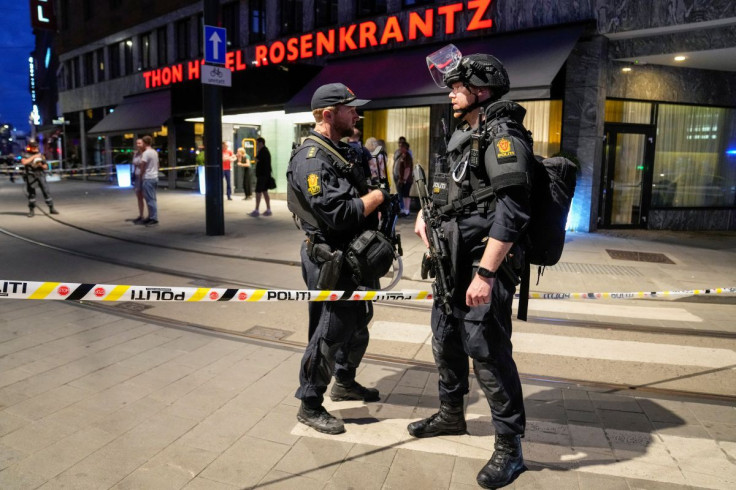Security forces stand at the site where several people were injured during a shooting outside the London pub in central Oslo, Norway June 25, 2022. Javad Parsa/NTB/via REUTERS  