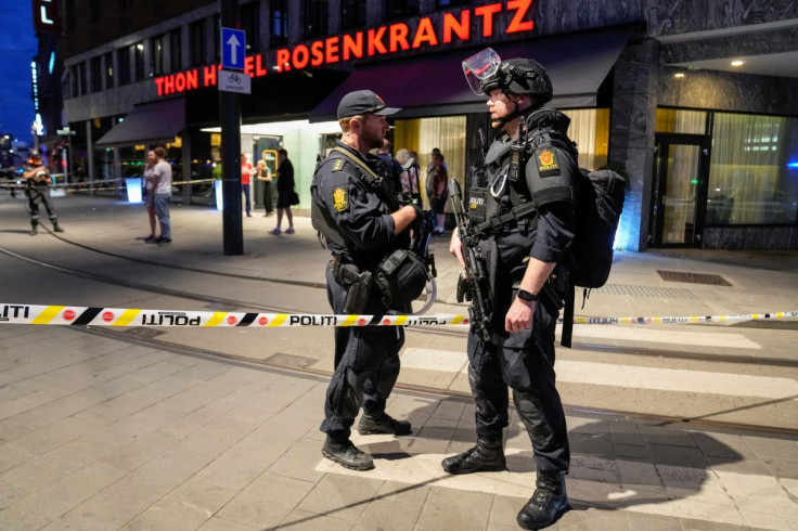 Security forces stand at the site where several people were injured during a shooting outside the London pub in central Oslo, Norway June 25, 2022. Javad Parsa/NTB/via REUTERS