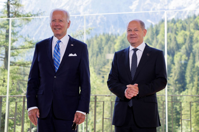 German Chancellor Olaf Scholz welcomes U.S. President Joe Biden ahead of their meeting on the day of G7 leaders summit at Bavaria's Schloss Elmau castle, near Garmisch-Partenkirchen, June 26, 2022. 
