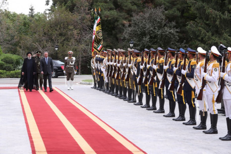 Iranian President Ebrahim Raisi walks with Iraqi Prime Minister Mustafa al-Kadhimi during a welcoming ceremony in Tehran, Iran, June 26, 2022. President Website/WANA (West Asia News Agency)/Handout via REUTERS 