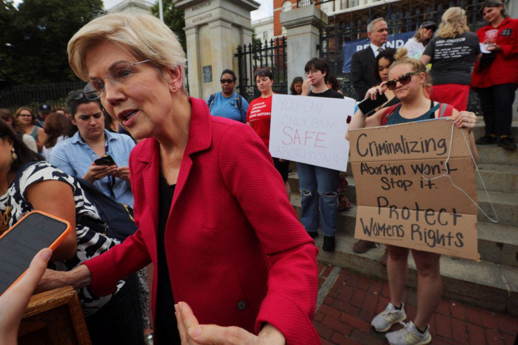 U.S. Senator Elizabeth Warren answers a reporter's question after speaking to abortion rights demonstrators gathered at the Massachusetts State House after the United States Supreme Court ruled in the Dobbs v. Women's Health Organization abortion case, ov