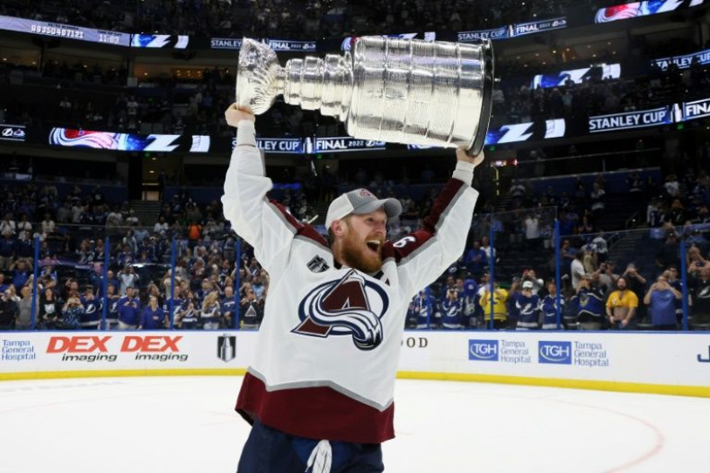 Colorado captain Gabriel Landeskog hoists the NHL Stanley Cup championship trophy over his head after the Avalanche won the title