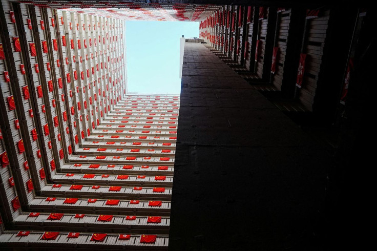Rows of Chinese and Hong Kong flags decorate a residential building, ahead of the 25th anniversary of Hong Kong's handover to China from Britain, in Hong Kong, China June 26, 2022.