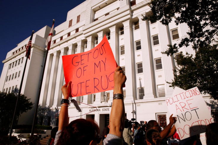 Pro-choice supporters protest in front of the Alabama State House as Alabama state Senate votes on the strictest anti-abortion?bill in the United States at the Alabama Legislature in Montgomery, Alabama, U.S. May 14, 2019.  