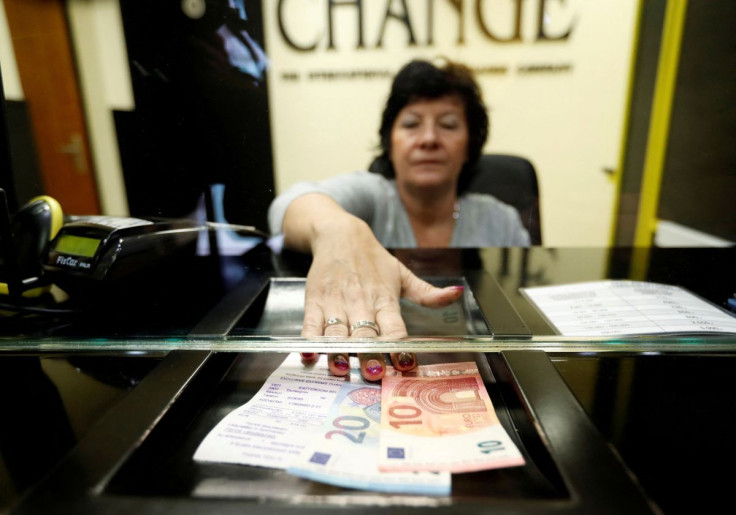 A Hungarian woman exchanges forints for euros at a currency exchange shop in Esztergom, Hungary  November 11, 2017. 