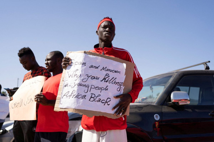 Protesters gather outside Melilla's short-stay migrants centre CETI after at least 23 migrants died trying to reach the Spanish enclave, in Melilla, Spain, June 27, 2022. 