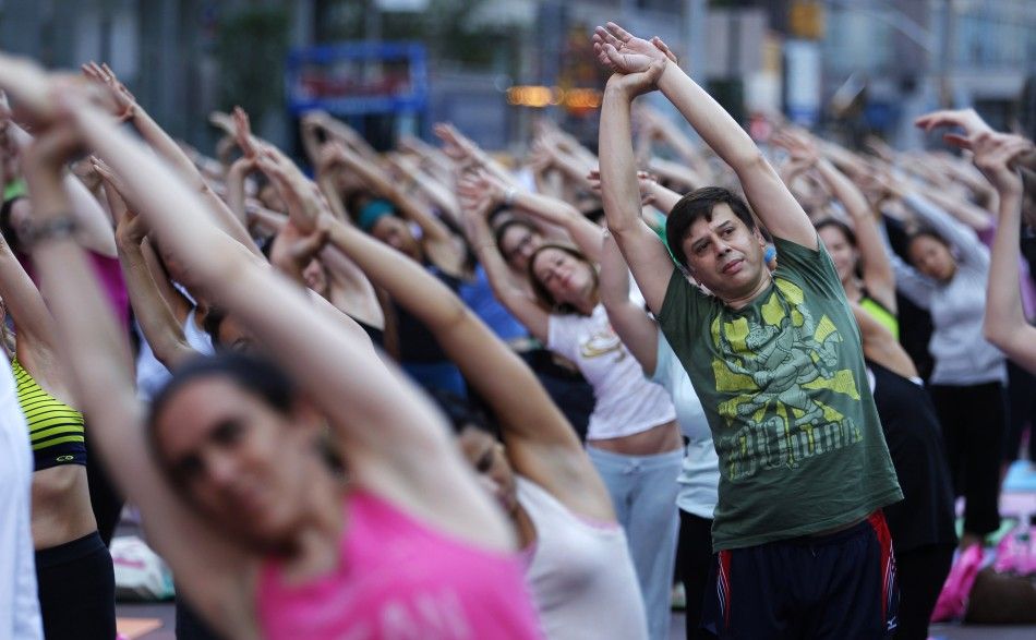 People practice yoga on the morning of the summer solstice in New Yorks Times Square June 21, 2010. The eighth annual quotSolstice in Times Squarequot event on Monday brought out thousands of participants to celebrate the years longest day