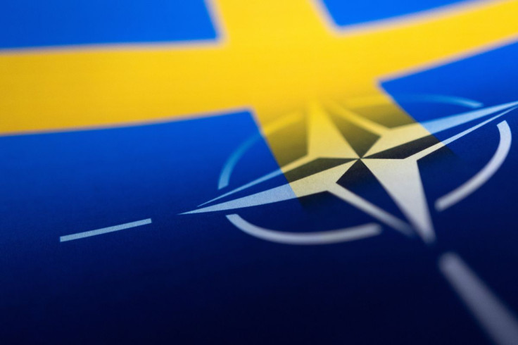 Swedish and NATO flags are seen printed on paper this illustration taken April 13, 2022. 