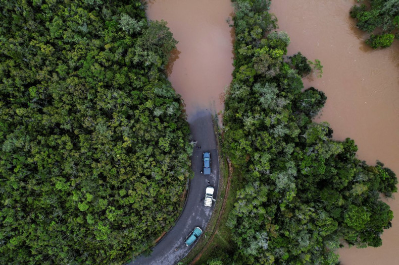 Cars stop before a flooded area, after Cyclone Batsirai made landfall, on a road in Vohiparara, Madagascar, February 6, 2022. Picture taken with a drone. 