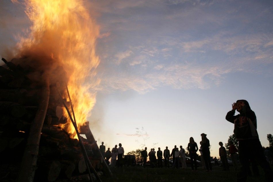 Locals observe a bonfire as they celebrate summer solstice in Tuja, about 75 km 47 miles from the capital Riga