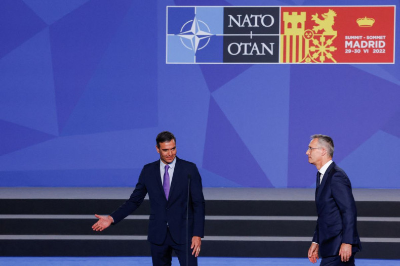 Spanish Prime Minister Pedro Sanchez gestures next to NATO Secretary General Jens Stoltenberg during their press statement ahead of a NATO summit in Madrid, Spain June 28, 2022. 