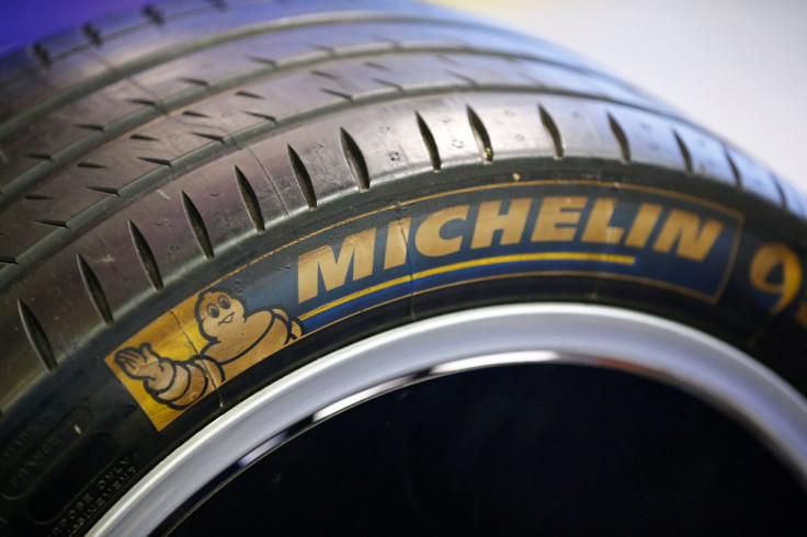 The logo of French tyre maker Michelin is seen on tyre of a Formula E racing car on display at the innovative center of German postal and logistics group Deutsche Post DHL in Troisdorf near Bonn, western Germany March 9, 2016.    