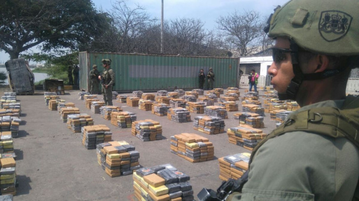 Soldiers stand guard next to packages containing cocaine after Colombian police seized more than six tonnes of the drug, in Barranquilla, Colombia April 2, 2017. Colombian Police/Handout via REUTERS