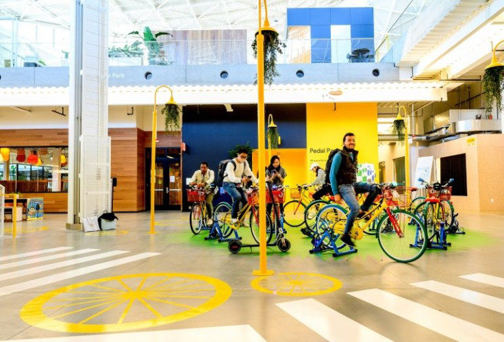 Visitors ride stationary bikes at Googleâs Bay View campus in Mountain View, California