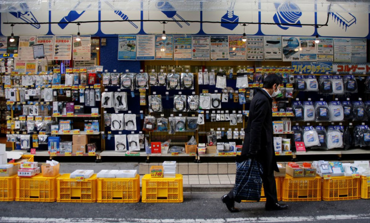 A man walks in front of an electronics store in Tokyo, Japan, January 10, 2017. Picture taken January 10, 2017.  