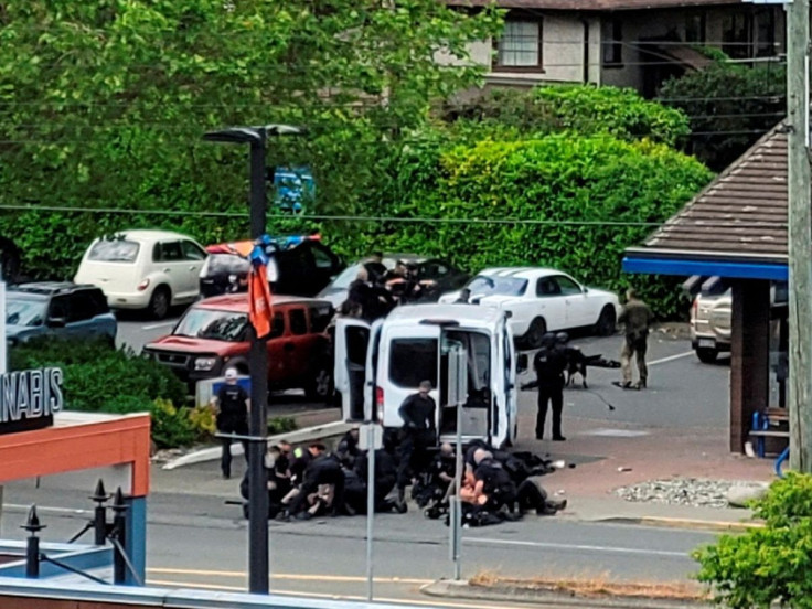 General view of the site where two armed suspects died and six police officers were shot, during an incident at a bank in Saanich, British Columbia, Canada June 28, 2022 in this picture obtained from social media. Joan B Flood/via REUTERS
