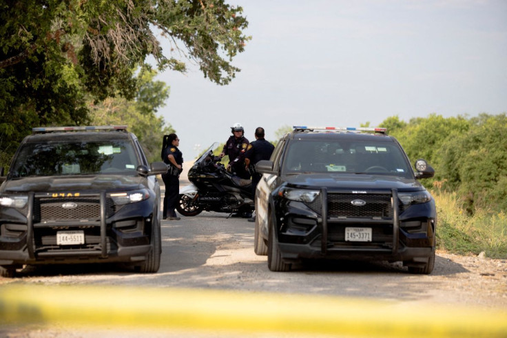 Law enforcement officers work at the scene where migrants were found dead inside a trailer truck in San Antonio, Texas, U.S. June 28, 2022.