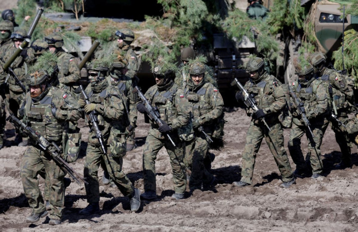 Members of the Polish 18th Mechanized Division and members of the U.S. 82nd Airborne Division participate in a joint military training to deepen the interoperability of their troops in Nowa Deba, Poland, April 8, 2022.  
