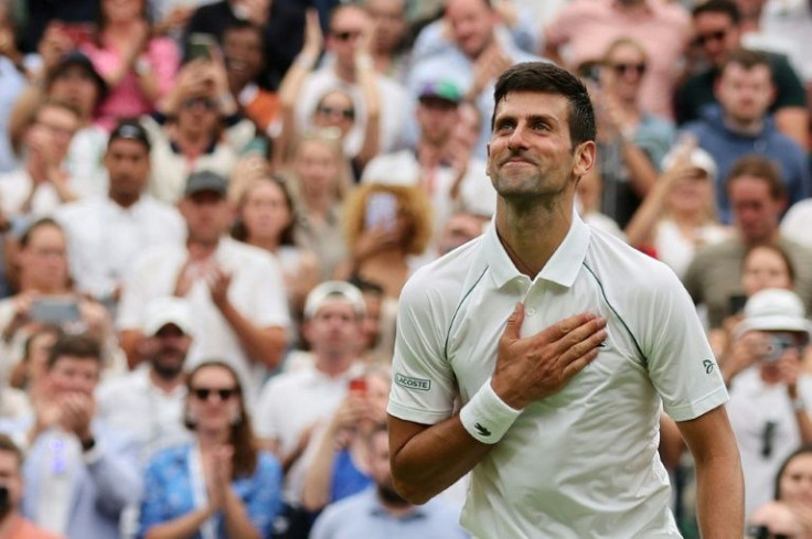 Champion: Novak Djokovic celebrates his first-round win over South Korea's Kwon Soon-woo