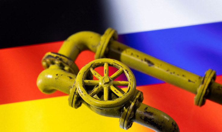 3D printed Natural Gas Pipes are placed on displayed German and Russian flags in this illustration taken, January 31, 2022. 