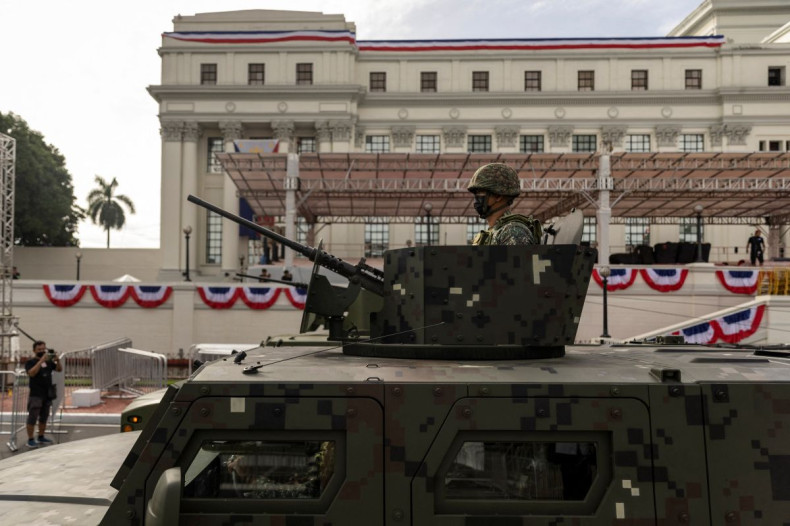 A military vehicle drives by during a parade rehearsal a day before the inauguration of president-elect Ferdinand "Bongbong" Marcos Jr. outside the National Museum in Manila, Philippines, June 29, 2022. 