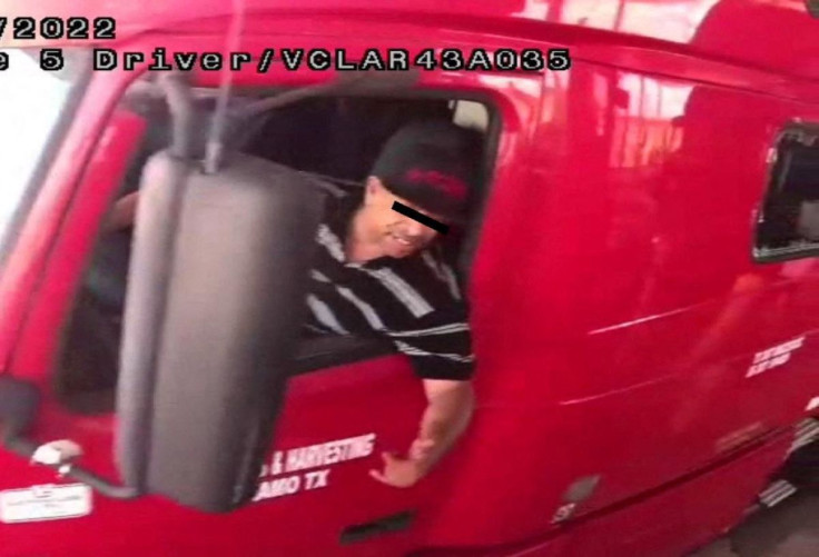 The alleged driver of a truck carrying dozens of migrants, identified by Mexican immigration officials as "Homero N", drives through a security checkpoint in this surveillance photograph in Laredo, Texas, in this handout photo distributed to Reuters on Ju