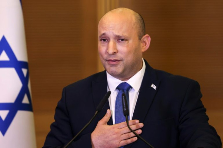 Israel's outgoing Prime Minister Naftali Bennett speaks to lawmakers from his Yamina party at the Knesset